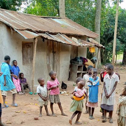 Children gathered outside a community home